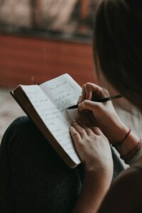 Woman writing in her journal